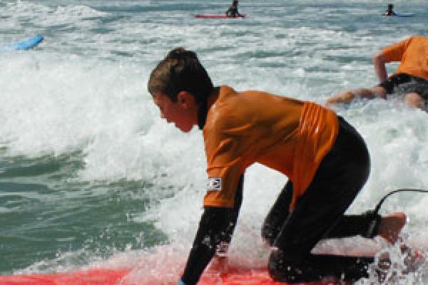 surfing the waves for surf lessons Middleton