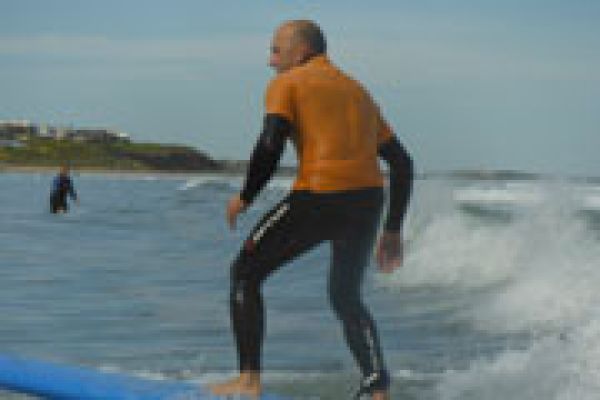 man learning how to surf in surf school south Australia