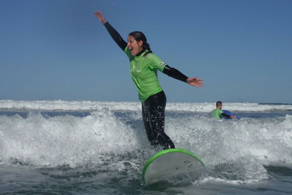 woman having fun surfing in Middleton