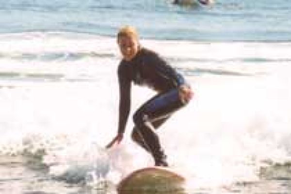 a girl having her surf lesson